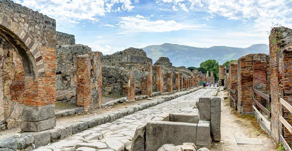 pompeii ruins in Italy with old road with arcs on a sunny day